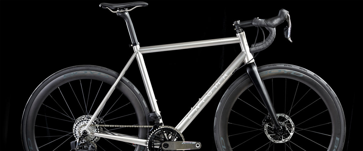 Enigma Ready to Ride Elan titanium road bike on a country lane