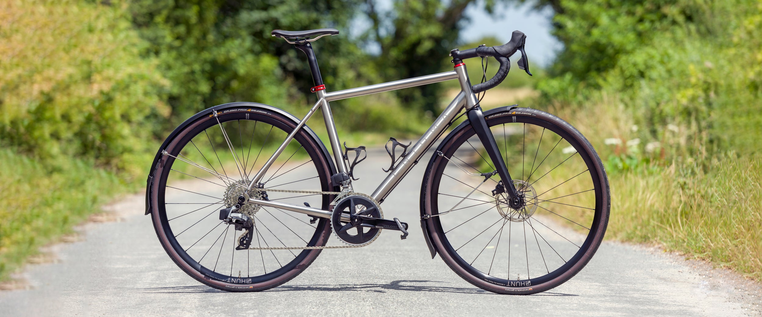 Enigma Etape titanium endurance bike equipped with full mudguards, ideal for year-round road riding