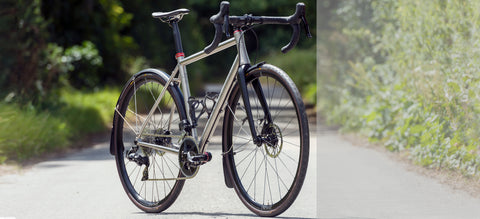 Enigma Etape titanium endurance bike equipped with full mudguards, ideal for year-round road riding