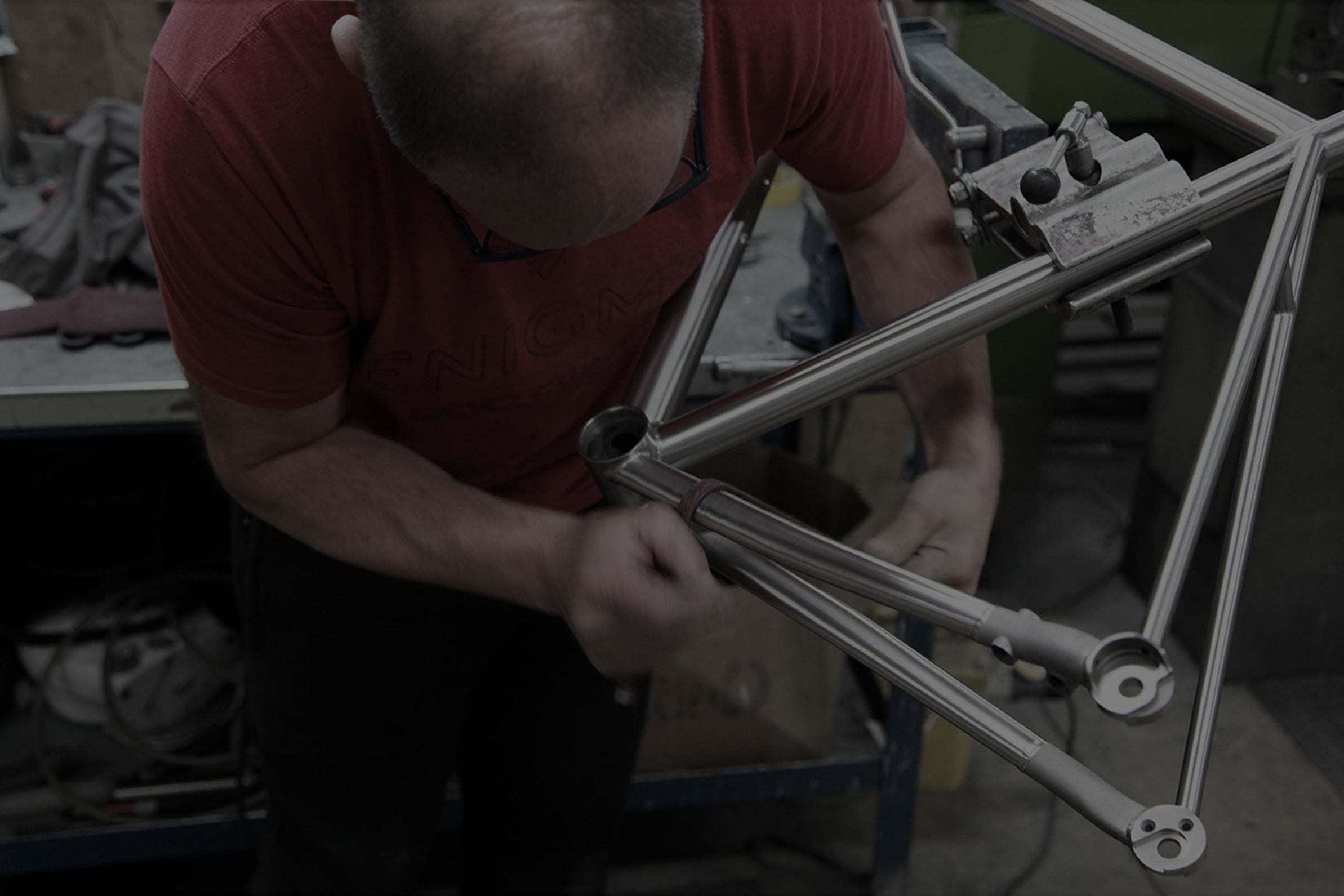 Titanium bicycle frame being professionally refinished in the Enigma workshop
