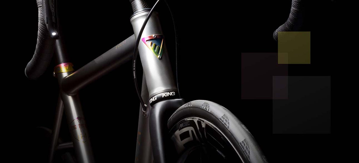Close up of the head tube and fork on an Enigma Signature Excel titanium road bike