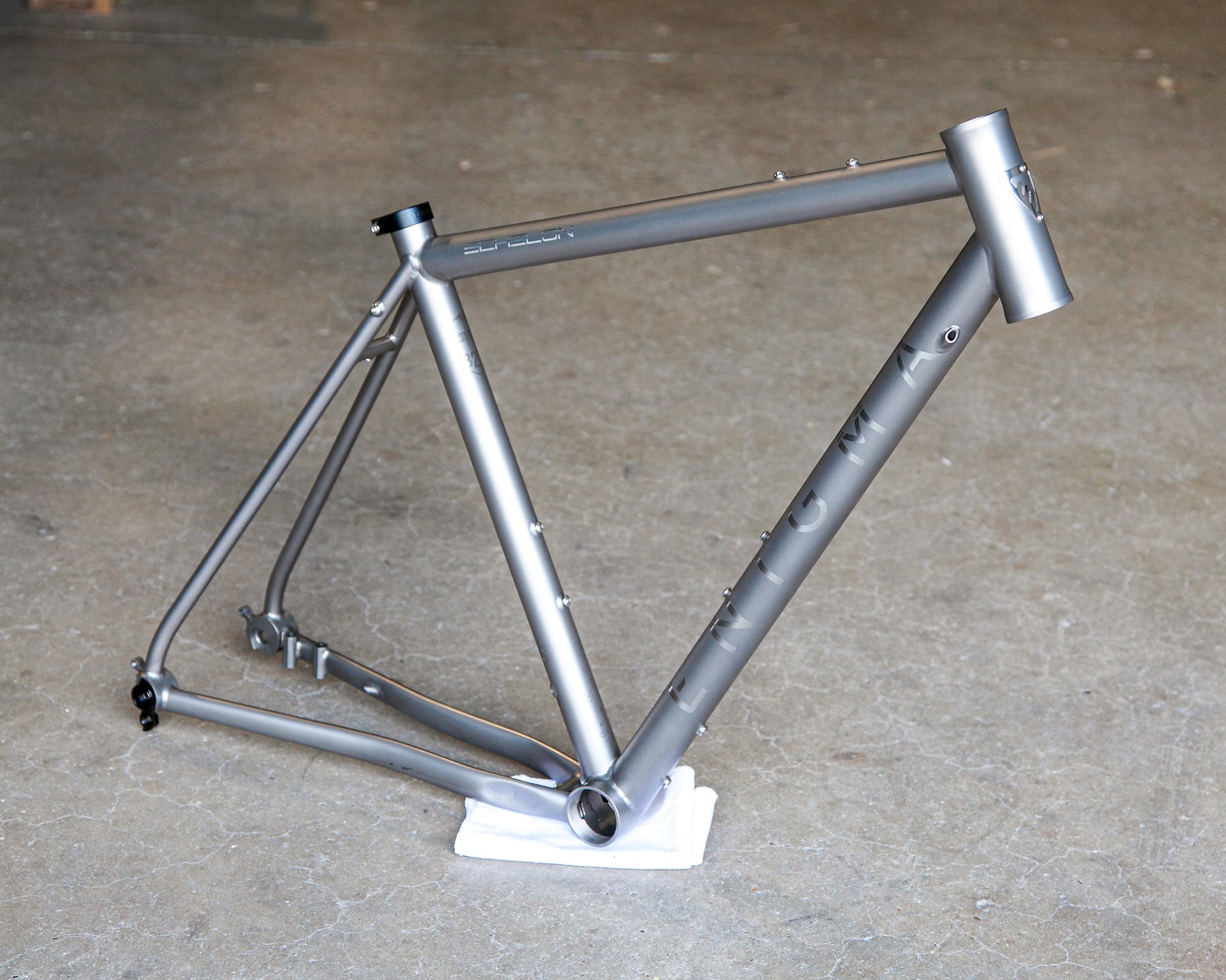 Enigma Echelon AR handcrafted titanium road frame with satin bead finish, brushed logos. Used but in good condition