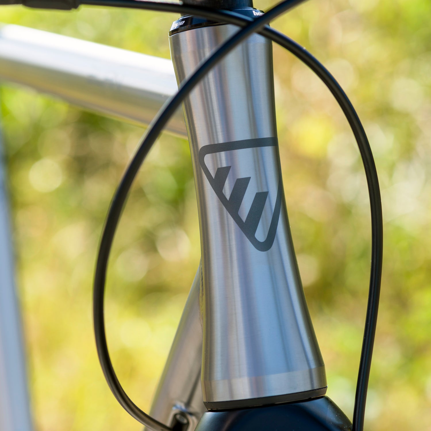 Tapered headtube with Enigma logo on the Elan Titanium, highlighting UK craftsmanship and frame detail