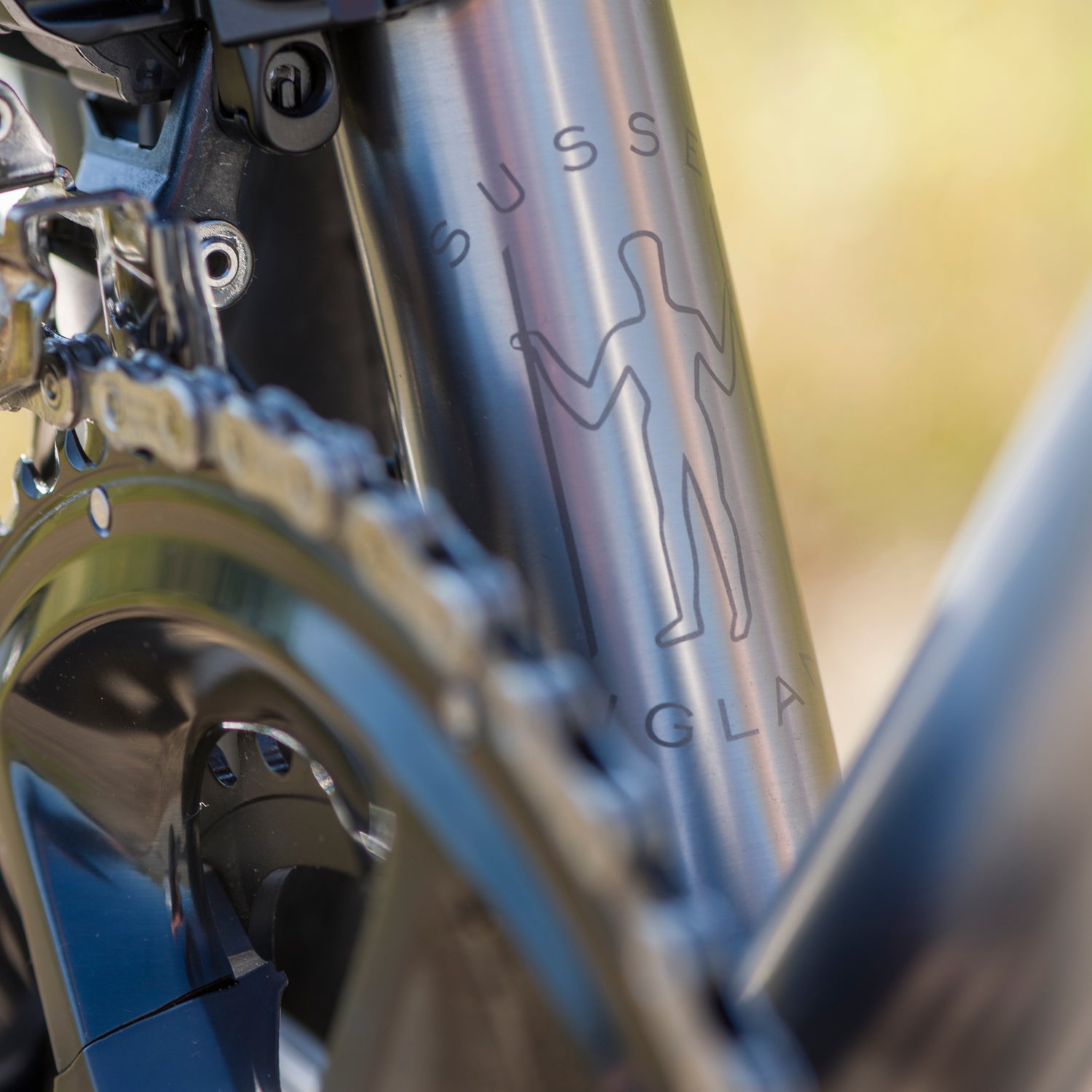 Close up of the The Long Man badge on the Enigma Elan Titanium frame, built in Sussex, UK
