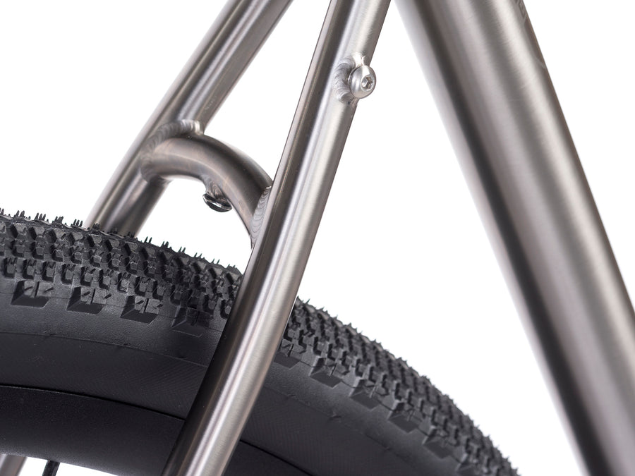 Enigma Escape titanium gravel bike showing generous rear tyre clearance