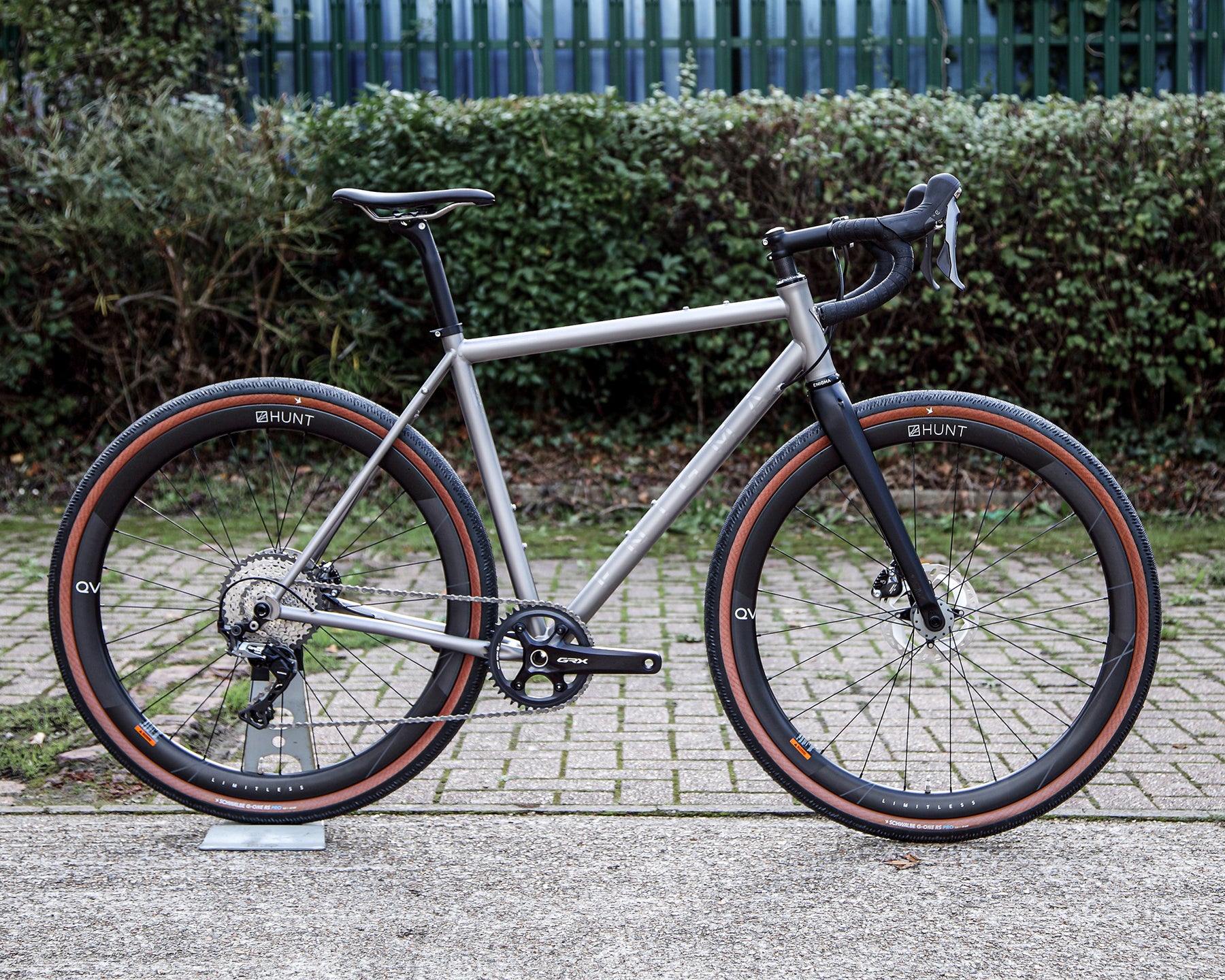 Enigma Esker Signature titanium gravel bike with Shimano GRX 1x11 drivetrain, Hunt x QVIST Limitless 40 carbon wheels and handcrafted titanium frame.