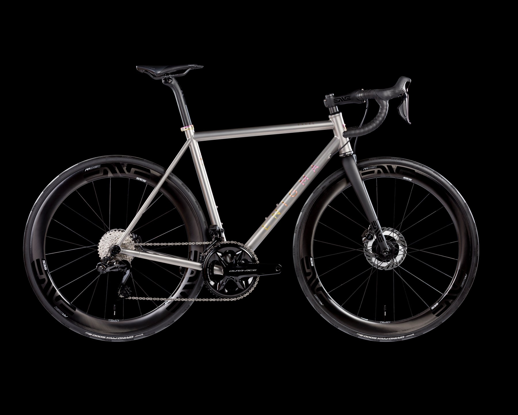 High-performance Excel titanium road bike with aerodynamic carbon wheels, disc brakes, and drop handlebars, designed for speed and endurance cycling.